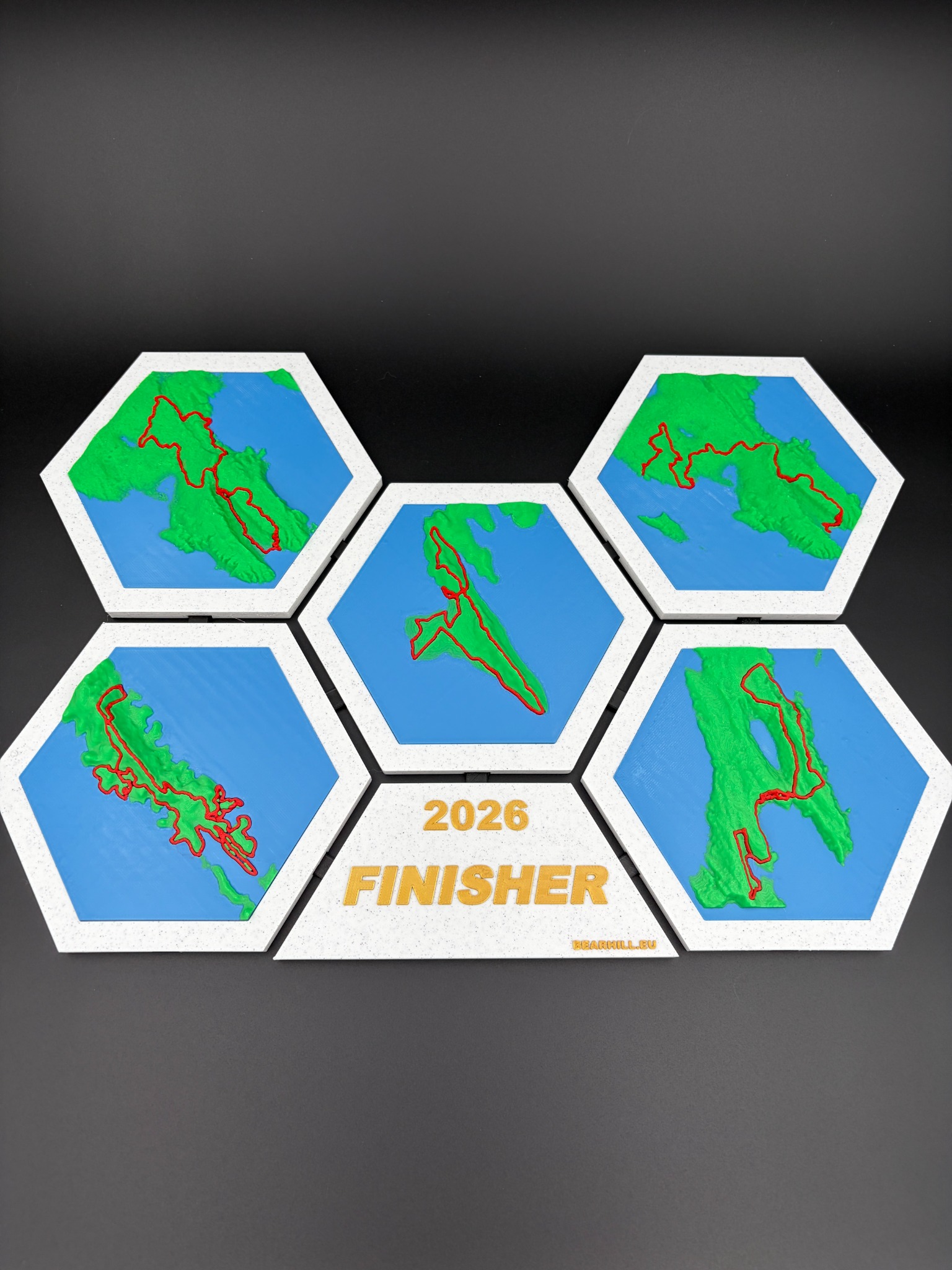 Complete four-piece 4Islands relief map displayed as a modular hexagonal set